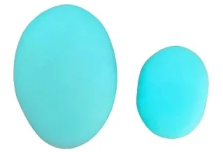 Close-up of individual pebbles, two sizes, aqua color